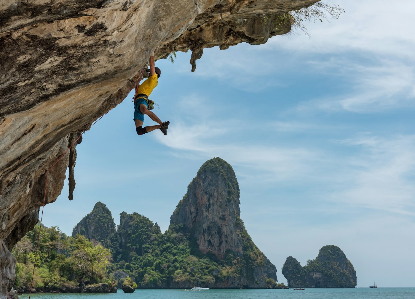 A climber on an overhanging rock face.